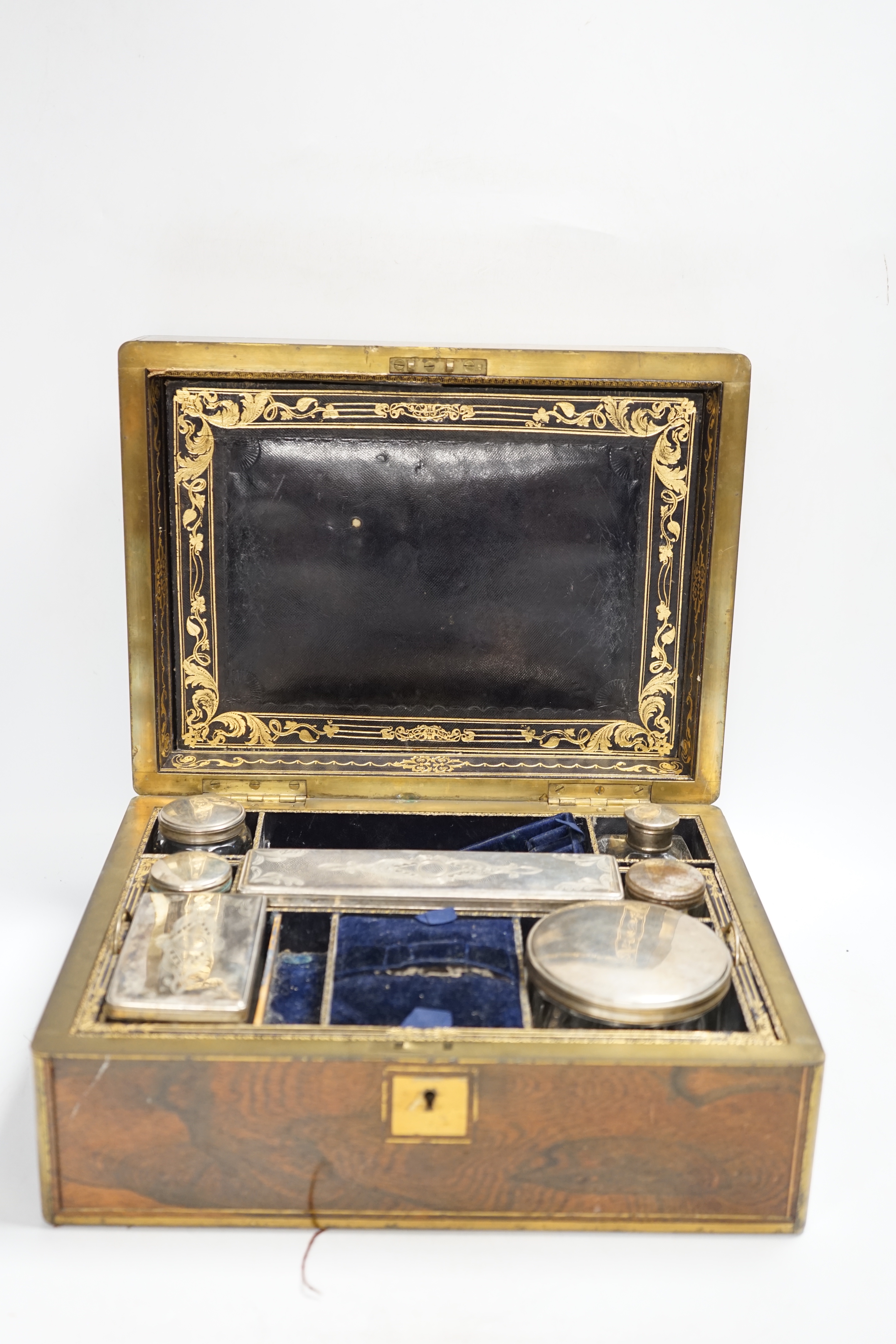 A Victorian rosewood brass bound toilet box, with silver plate mounted bottles and Amber and Jet beads box, 31.5cm wide x 14cm high